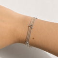 Sylva Three Layer Bracelet silver on model wrist — Tamola Jewellery