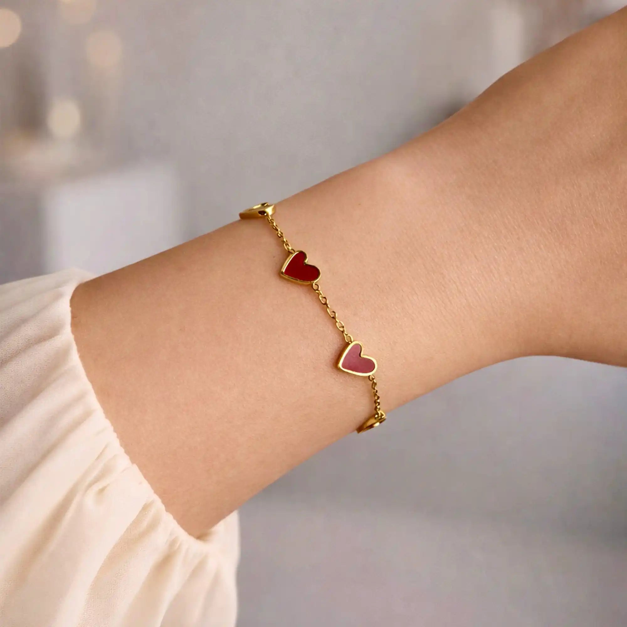 Amora Heart Chain Bracelet gold on model wrist — Tamola Jewellery