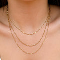Elara Layered Necklace three delicate chains gold stainless steel on model — Tamola Jewellery