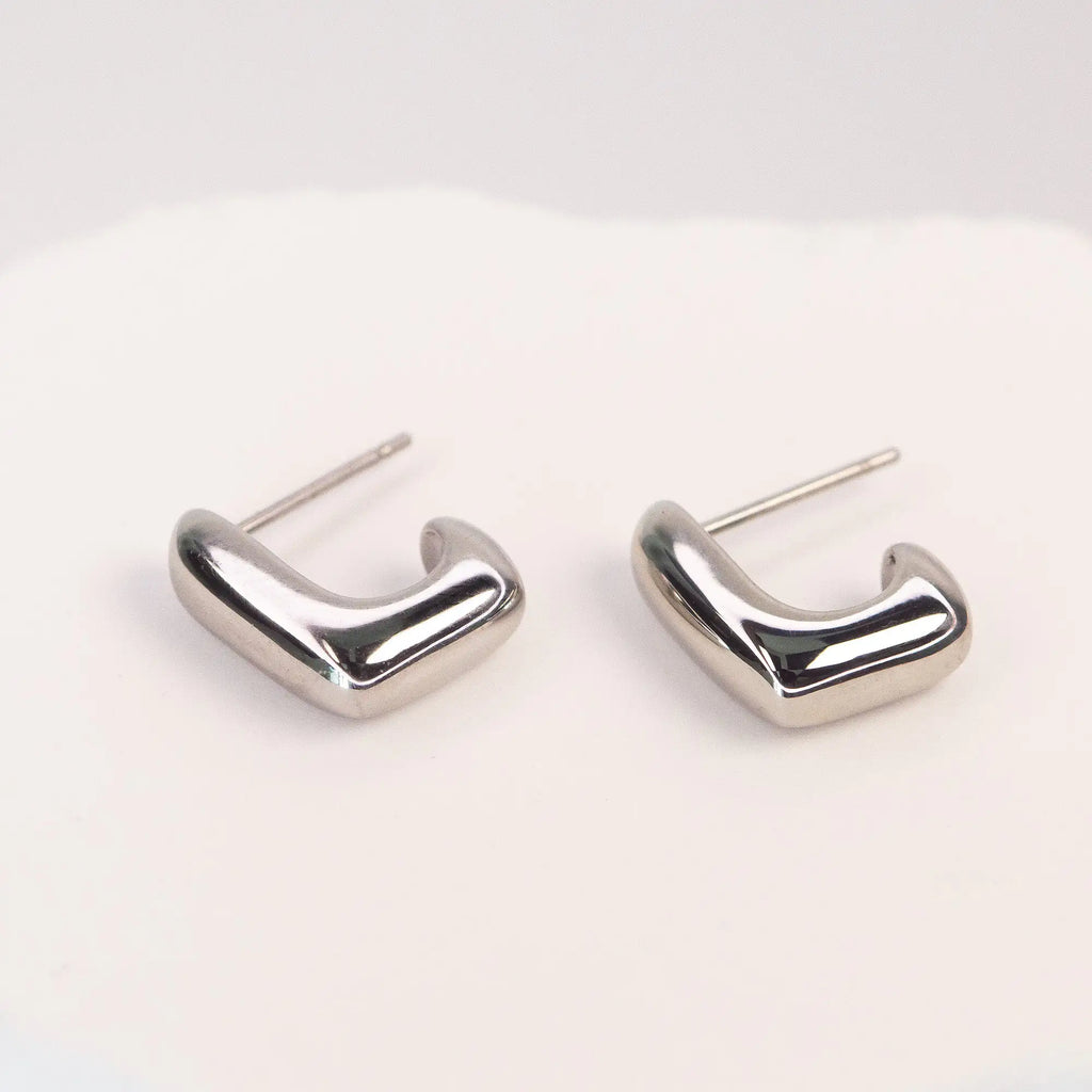 Solène Sculptural Huggie Earrings silver stainless steel — Tamola Jewellery